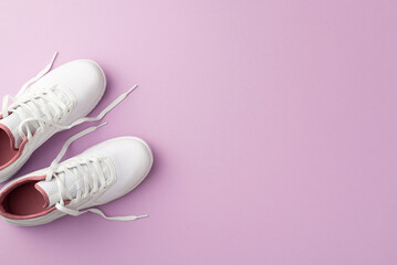 Fitness concept. Top view photo of white sneakers on isolated pastel violet background with copyspace