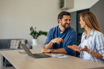 Smiling people, talking to each other, working together.