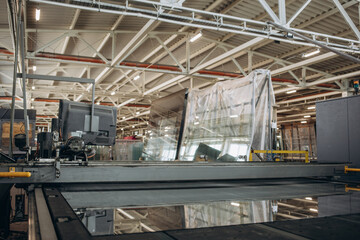 Factory for aluminum and PVC windows and doors production. Details industrial equipment. Background