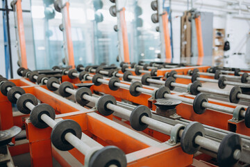 Obraz premium Conveyor belt for production a window pane. Industrial equipment. Background