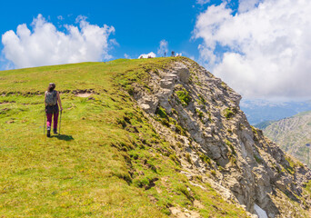 Naklejka na ściany i meble Monte Gorzano, Italy - The highest peak in the mountain range named Monti della Laga, Lazio and Abruzzo region, with Cento Fonti waterfalls and hikers who practice trekking in altitude.