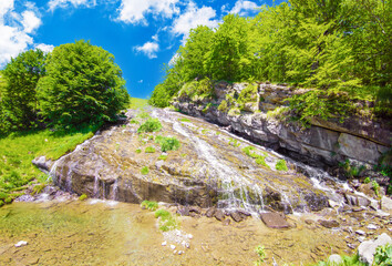 Fototapeta na wymiar Monte Gorzano, Italy - The highest peak in the mountain range named Monti della Laga, Lazio and Abruzzo region, with Cento Fonti waterfalls and hikers who practice trekking in altitude.