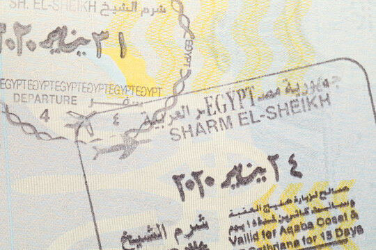 MYKOLAIV, UKRAINE - FEBRUARY 23, 2022: Passport page with Egypt visa stamps, closeup