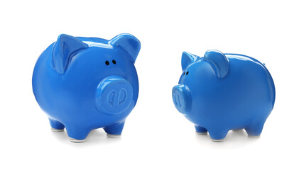 Blue ceramic piggy banks on white background