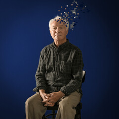 Fototapeta na wymiar Elderly man with dementia on blue background. Illustration of head losing fragments