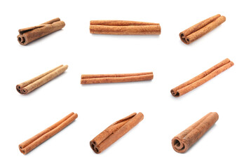 Set with aromatic cinnamon sticks on white background