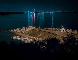 Small port with beautiful view and background city lights
