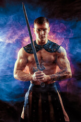 Fototapeta na wymiar Antique warrior with sword against background with smoke