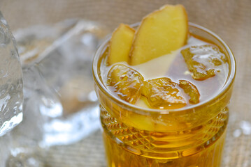 alcoholic sour cocktail decorated with slices of ginger macro