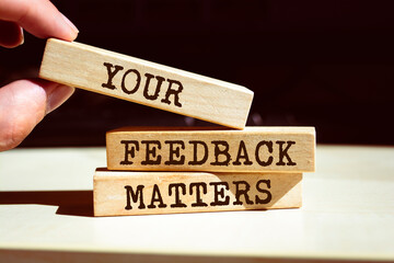 Wooden blocks with words 'Your Feedback Matters'.