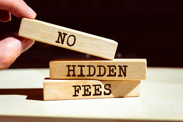 Wooden blocks with words 'no hidden fees'.