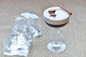 coffee alcoholic drink with foam with ice on the background