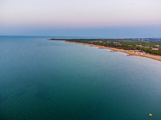 Sunrise in Lignano Sabbiadoro seen from above. From the sea to the lagoon, the city of holidays