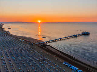 Obraz premium Sunrise in Lignano Sabbiadoro seen from above. From the sea to the lagoon, the city of holidays