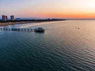 Sunrise in Lignano Sabbiadoro seen from above. From the sea to the lagoon, the city of holidays