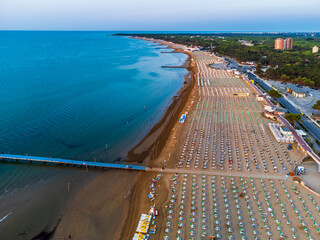 Sunrise in Lignano Sabbiadoro seen from above. From the sea to the lagoon, the city of holidays