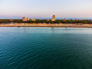 Sunrise in Lignano Sabbiadoro seen from above. From the sea to the lagoon, the city of holidays