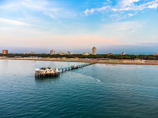 Fototapeta premium Sunrise in Lignano Sabbiadoro seen from above. From the sea to the lagoon, the city of holidays