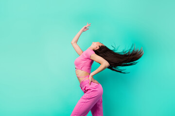 Profile side image of young energetic lady have fun on dancing floor feel freedom isolated on teal color background