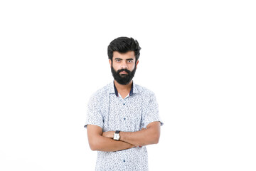 Fototapeta premium Young indian man giving expression over white background.