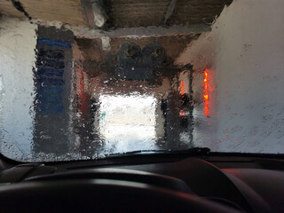 View of an automatic car wash from inside a car