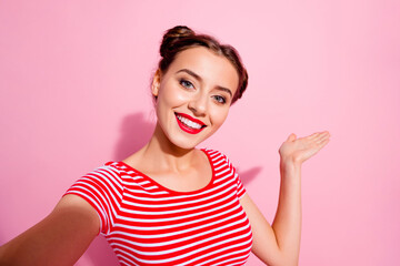 Photo of pretty sweet woman wear cropped t-shirt smiling tacking selfie arm empty space isolated...
