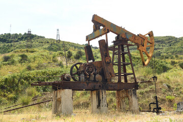 Fototapeta na wymiar Old oil rigs in the Albanian mountains.