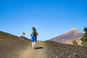 man hiking towards the volcano in El Teide national park  Tenerife