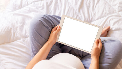 Pregnancy mockup digital tablet. Pregnant woman holding smart tablet. Mobile pregnancy online maternity application mock up. Concept maternity, pregnancy, childbirth.