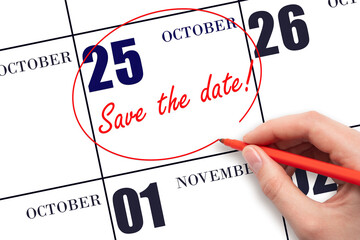 Hand drawing red line and writing the text Save the date on calendar date October 25.