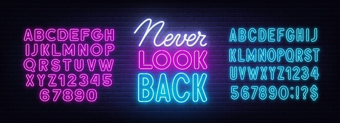 Never Look Back neon sign on brick wall background.