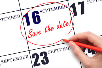 Hand drawing red line and writing the text Save the date on calendar date September 16.