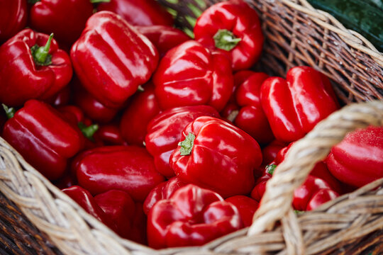 Red peppers in a basket on a market stall