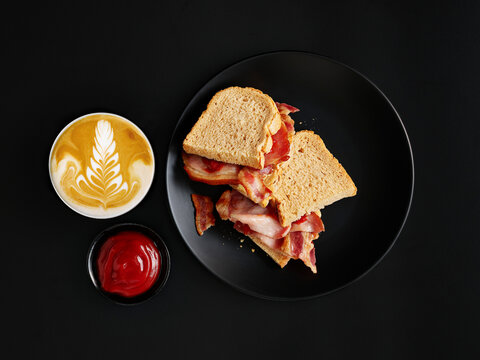 Hearty breakfast with ham on toast and cappuccino