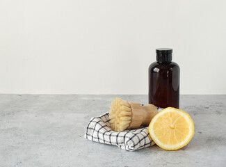 Home cleaning non toxic, natural products. Plastic free, zero waste lifestyle. Cleaning tools layout vs backing soda, lemon, mustard powder and bamboo brushes