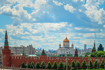 Wall and towers of Moscow Kremlin with Cathedral of Christ the Savior. Moscow, Russia.