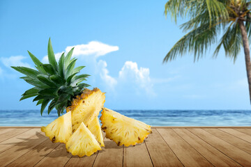 Slice of fresh pineapple on wooden table