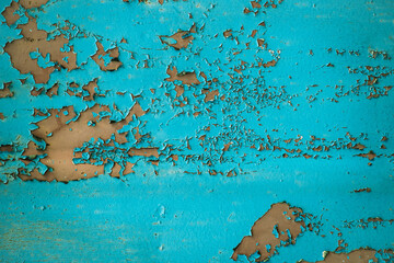 Aged blue weathered background with cracks and rust or grunge rough surface backdrop.