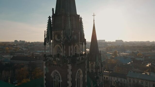 Epic Aerial footage from drone fliying around dome and pillar of Church of St. Olga and Elizabeth old gothic temple in town Lviv, Ukraine. landmarks, architecture of ancient european city