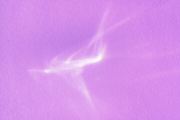 Beautiful lights and shadows of glass on purple background. Overlay mode. Caustic effect of light....