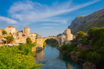 Photo sur Plexiglas Stari Most Fantastic Skyline of Mostar with the Mostar Bridge, houses and minarets, during sunny day. Location: Mostar, Old Town, Bosnia and Herzegovina, Europe