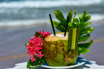 aphrodisiac drink served in a coconut on brazilian beach, porto galinha
