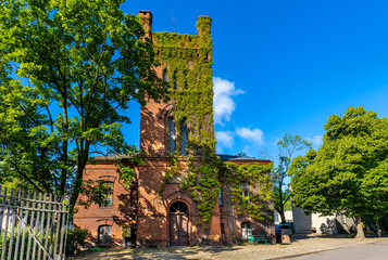 XIX century brick stronghold with tower of Primate Palace - Palac Prymasowski - within Palace and...