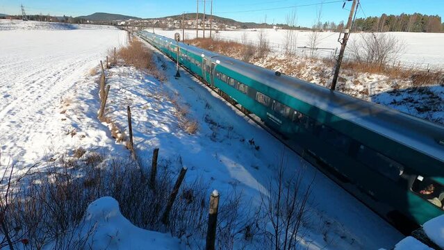 Bergen to Oslo train near Honefoss, Norway in Winter