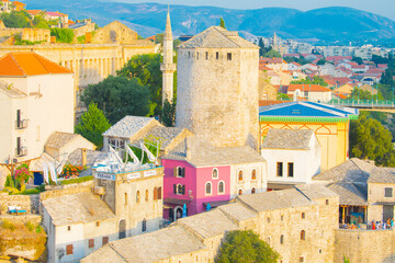 Fantastic Skyline of Mostar with the Mostar Bridge, houses and minarets, during sunny day....