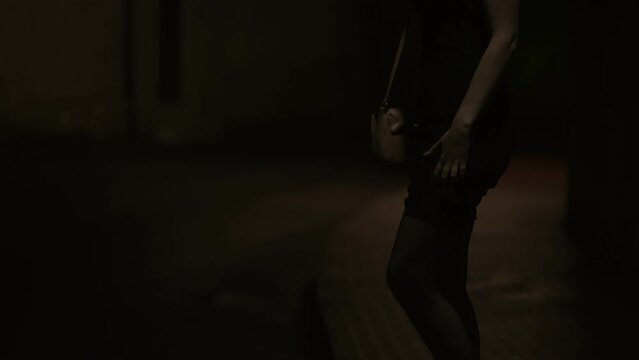 Prostitute waiting for the client at night street.
