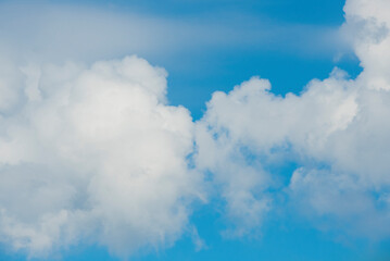 Naklejka na ściany i meble clouds kissing on the sky .blue sky with white clouds for banner card wallpaper background