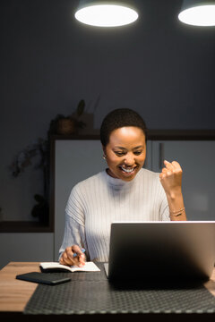 Young successful black woman working from home