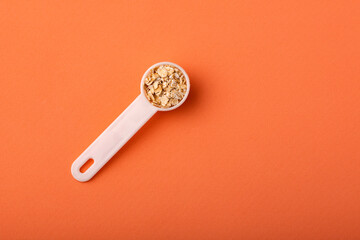 Oat flakes in the spoon - Avena sativa