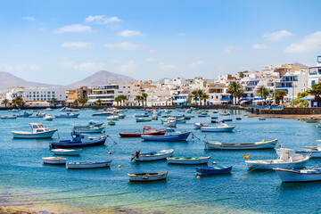 Beautiful downtown of Arrecife with many boats floating on blue water, Lanzarote, Canary Islands, Spain